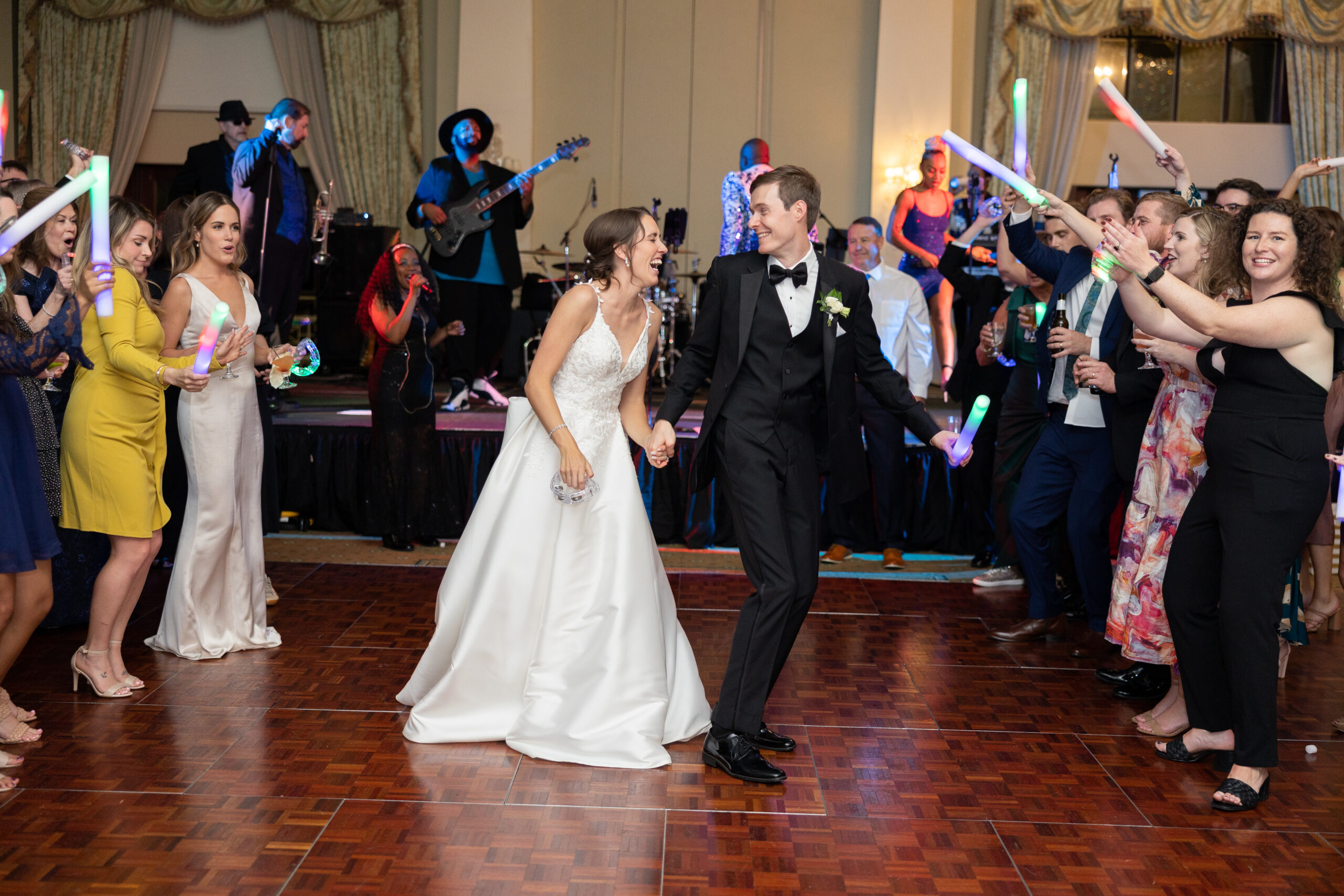 Bride and groom on dance floor laughing and having a great time