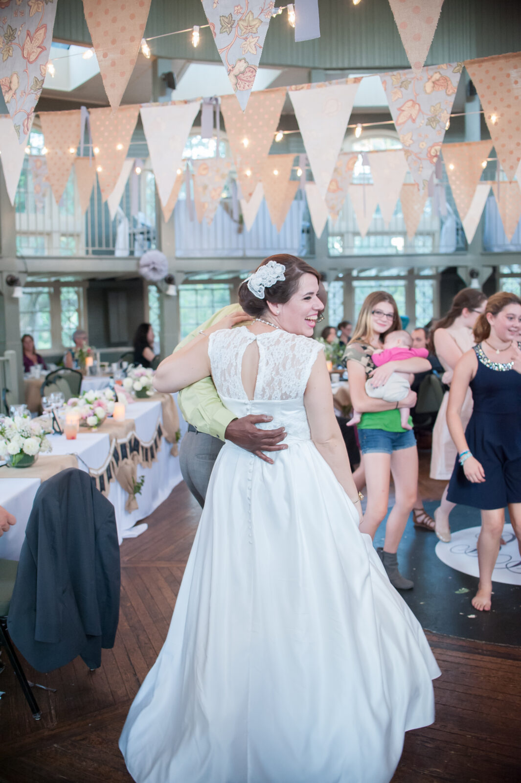 Bride laughing on the dance floor at wedding venue wilmington nc 
